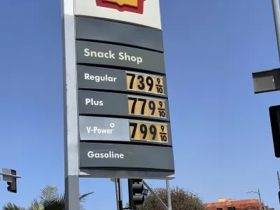 A sign with gas prices all listed above $7.39 per gallon.
