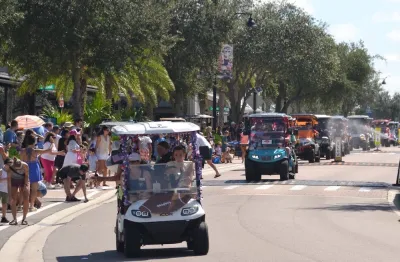 Labor Day golf cart parade on street in Babcock Ranch, Florida.