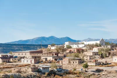 The Laguna Pueblo, a Native American reservation near Albuquerque, New Mexico, is perched on a hill in the sun.