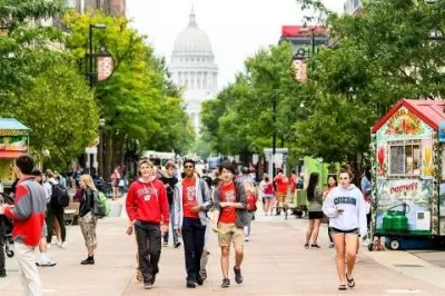 University of Wisconsin Madison students walking down LIbrary Mall pedestrian area in Madison, WI