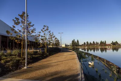 Gravel walkway along lake at Earvin Magic Johnson Park in Los Angeles County.