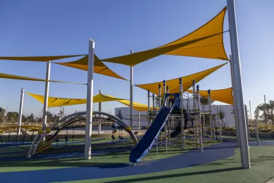 Playground with yellow shade sails and blue equipment in Los Angeles, California
