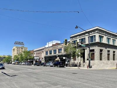 Main Street with two-story brick buildings in Bozeman, Montana.