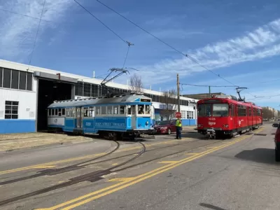 A pair of vintage Siemens–Duewag U2 trolleys roll out of a garage in Memphis. 
