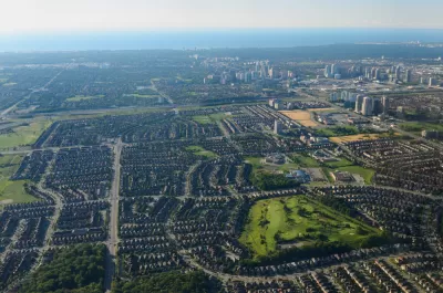 An aerial view of Mississauga, Ontario, with Lake Ontario in the background.