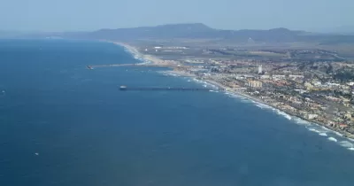 An aerial photo of the Oceanside Pier in Oceanside. The Oceanside Marina is also visible.