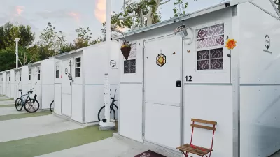 Row of Pallet Shelter tiny home units with bicycles in front