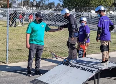 Children learning to skateboard