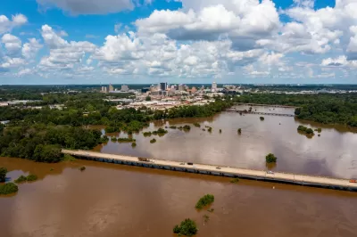 The Pearl River floods with brown near downtown Jackson, Mississippi.