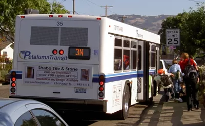 Passengers boarding a Petaluma Transit bus.