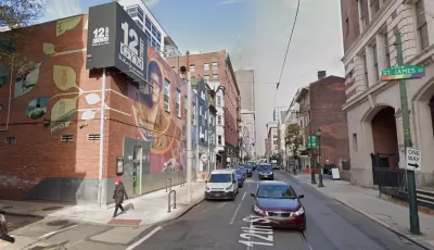 An image of a mural depicting Gloria Casarez on the outside of a gym on 12street in Philadelphia.