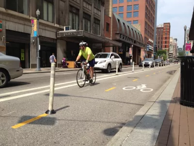 Cyclist riding on a downtown Pittsburgh bike lane