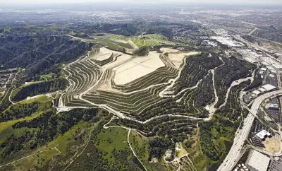 Aerial view of Puente Hills landfill on green hill in Los Angeles County, California.
