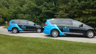 Two black and blue RIDE vans
