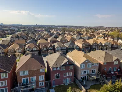 Row after row after row of single-family residences, with the high rises of the city of Toronto looming far in the background.