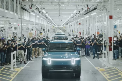 The first R1T built for a customer rolling off Rivian's assembly line at their plant in Normal, IL