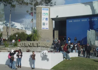 Front of San Diego High School with students milling around.