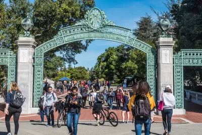 Students passing through the historic Sather Gate on the University of California, Berkeley campus.