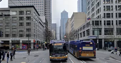 Google Street View of Third Avenue in Seattle with buses and pedestrians