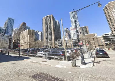 Google Street view of 250 Water Street parking lot with tall buildings in background