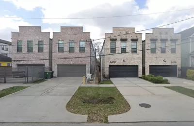 Two-story split lot housing in Houston, Texas with two-car garages