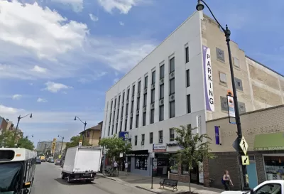 Google street view of white parking garage building in Chicago in 2018 prior to conversion to apartments
