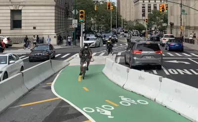 Green painted and protected bike lane on Centre Street