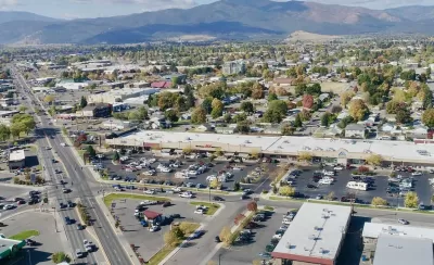 Aerial view of midtown Missoula, Montana with mountains in background