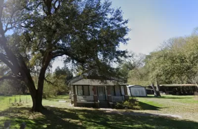 Google Street view of small one-story wooden house in Sandridge, South Carolina