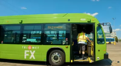 Green Portland Frequent Express bus in parking lot in Portland, Oregon.