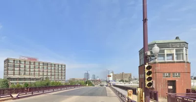 Google street view of wide bridge over Chicago River with small brick towers at corners.