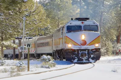 Train passing through a snowy landscape.