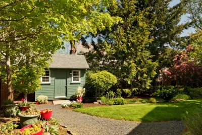 Small green ADU cottage in lush backyard in San Jose, California.