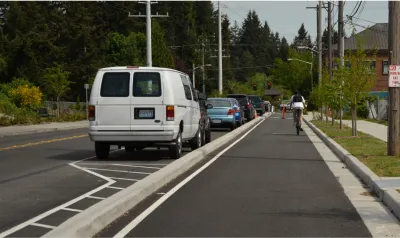 Cyclist rides in protected bike lane in Jacksonville, Florida.
