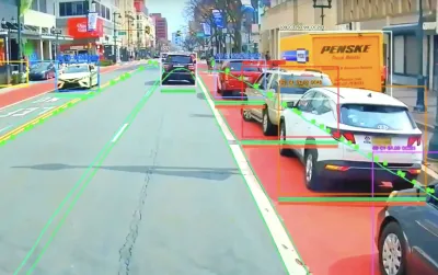 View from bus-mounted AI-assisted camera identifying vehicles parked in red designated bus lane.