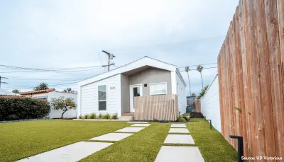 Small light colored backyard dwelling unit.