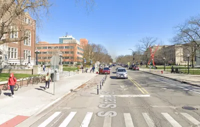 Street view of State Street in Ann Arbor, Michigan with protected bike lane.