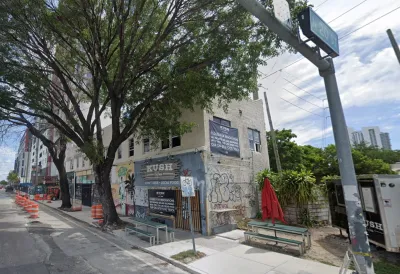 Google street view of corner restaurant in two-story building in Miami, Florida.