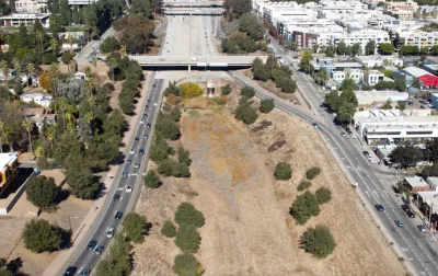Aerial view of vacant land at end of 710 freeway in Pasadena, California framed by roads on either side.