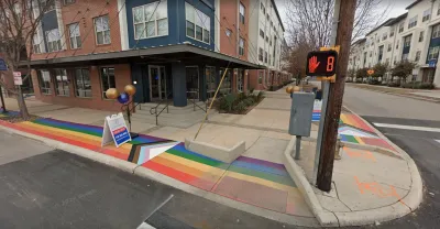 A sidewalk painted with a rainbow in San Antonio
