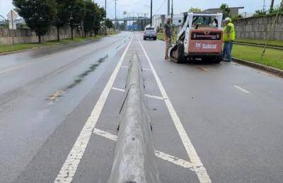 Concrete barrier separating bike lane and street in Nashville, Tennessee.