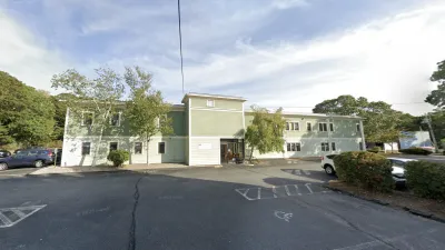 A long, green building that is the proposed location of the Catholic Charities of the Diocese of Fall River's new shelter.