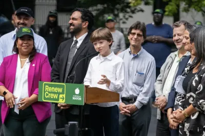 Eight-year old Max Kakhidze speaks at a press conference with Zohran Mandami in the background.