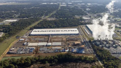 An aerial view of the xAI data center in Mississippi. Smoke is billowing out of turbines. 