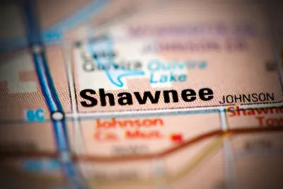 A map focuses on the city of Shawnee, Kansas and its surrounding roads and neighboring towns.