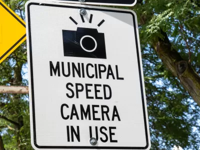 "Municipal speed camera in use" sign