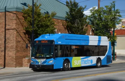 Blue Sun Metro bus on street in El Paso, Texas. 