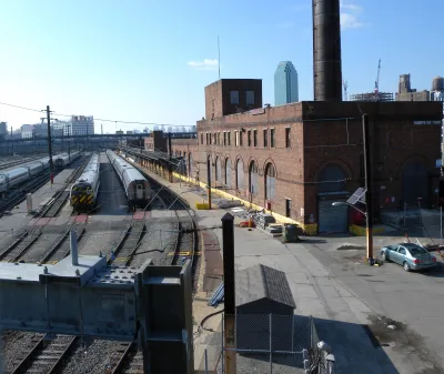 Brick buildings next to railyards.