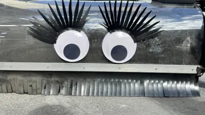 Close-up on googly eyes on bike lane sweeper.