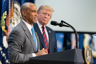 The U.S. Secretary of Housing and Urban Development Scott Turner and President Donald Trump at a press conference.
